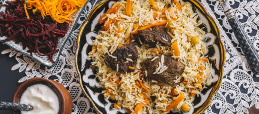 top view of rice with carrot cooked with lamb served with yogurt and salad top view of rice with carrot cooked with lamb served with yogurt and salad